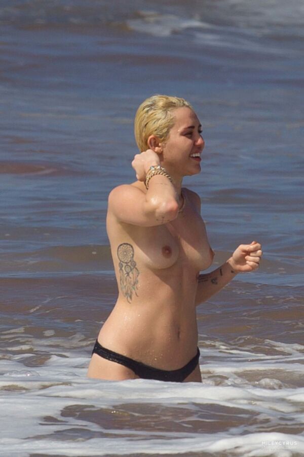 Free porn pics of Short-haired Miley Cyrus topless 4 of 38 pics