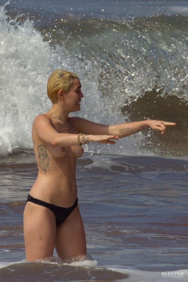 Free porn pics of Short-haired Miley Cyrus topless 5 of 38 pics