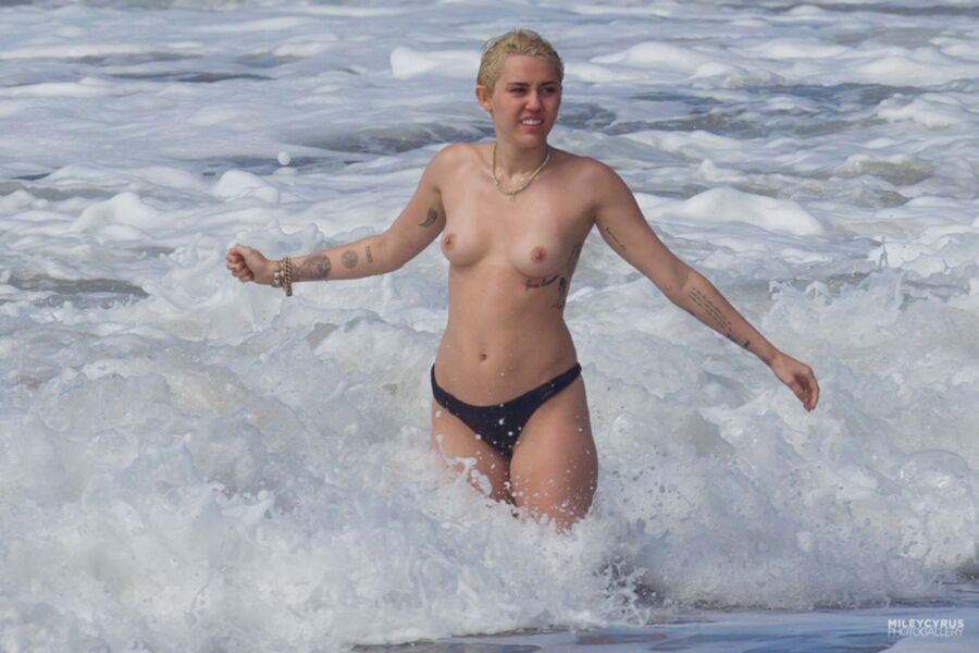 Free porn pics of Short-haired Miley Cyrus topless 8 of 38 pics