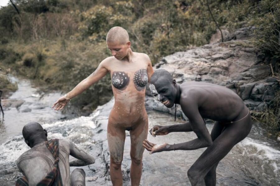 Free porn pics of Bald headed white girl in Africa 4 of 7 pics