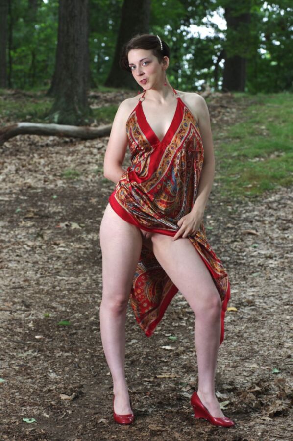 Free porn pics of Short haired cutie outdoor in red dress 12 of 25 pics