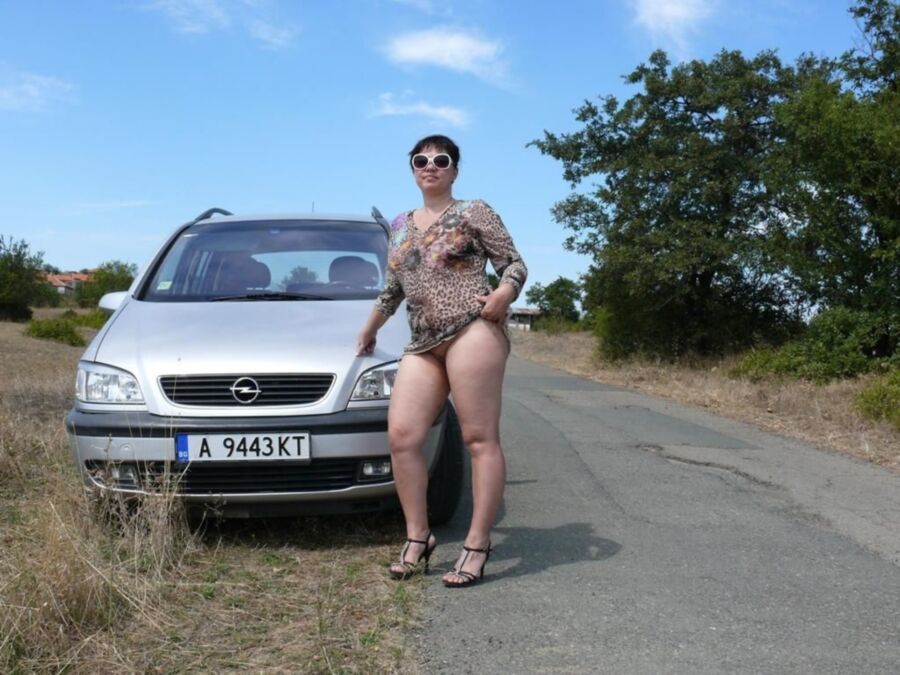 Free porn pics of Naked slut behind the wheel. 2 of 21 pics