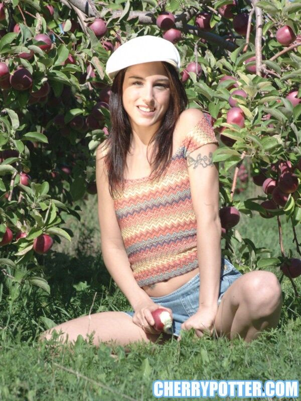 Free porn pics of Cherry Petite stripping while apple picking 17 of 80 pics