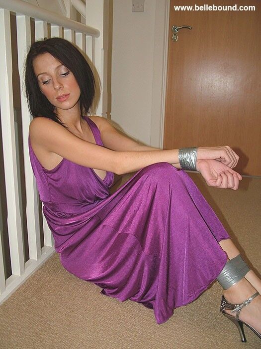 Free porn pics of Chrissy - Tape bound in evening dress and strappy heels 4 of 40 pics