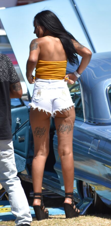 Free porn pics of Car show Latina in white booty shorts and a yellow top 2 of 17 pics