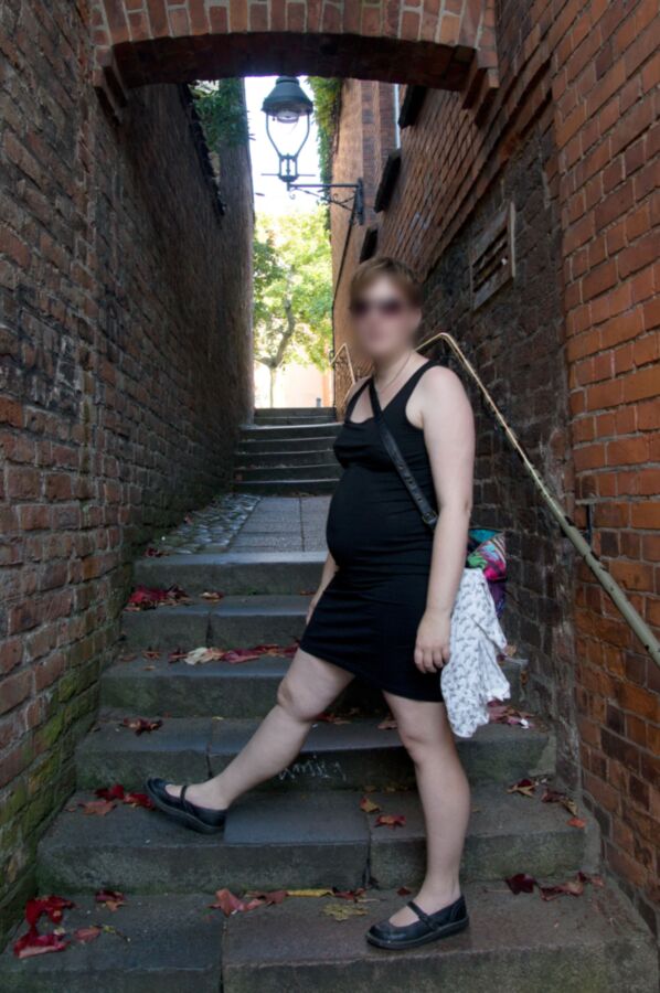 Free porn pics of My preggo slave on vacation with black dressed outdoor and no... 6 of 6 pics
