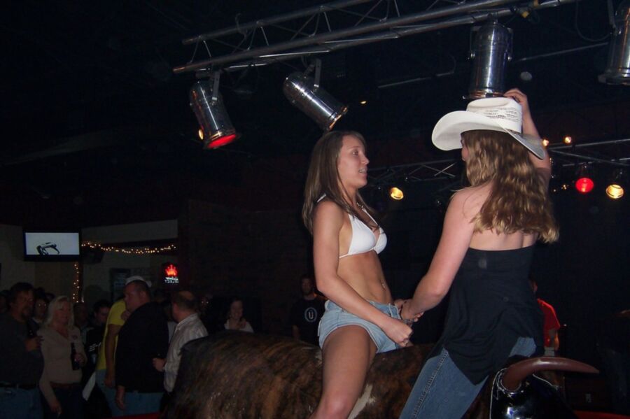Hotties riding a mechanical bull - Nuded Photo.