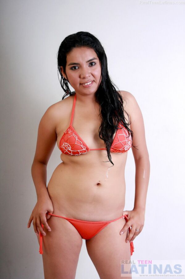 Free porn pics of Chuby Latina Lorena poses in her orange bikini 3 of 15 pics