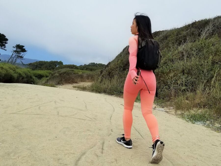 Free porn pics of Hot Asian walking around in tight pink yoga pants at the Beach p 5 of 14 pics