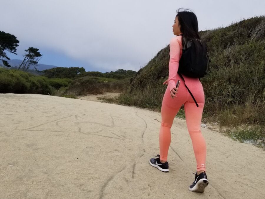 Free porn pics of Hot Asian walking around in tight pink yoga pants at the Beach p 3 of 14 pics