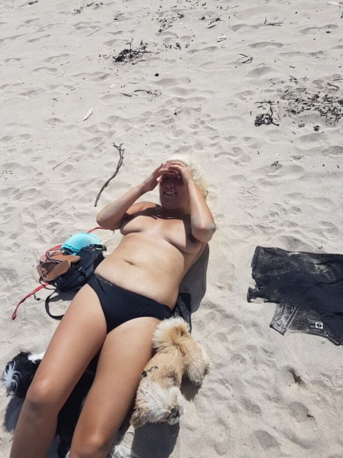 Free porn pics of Topless sunbathing on the beach 5 of 9 pics