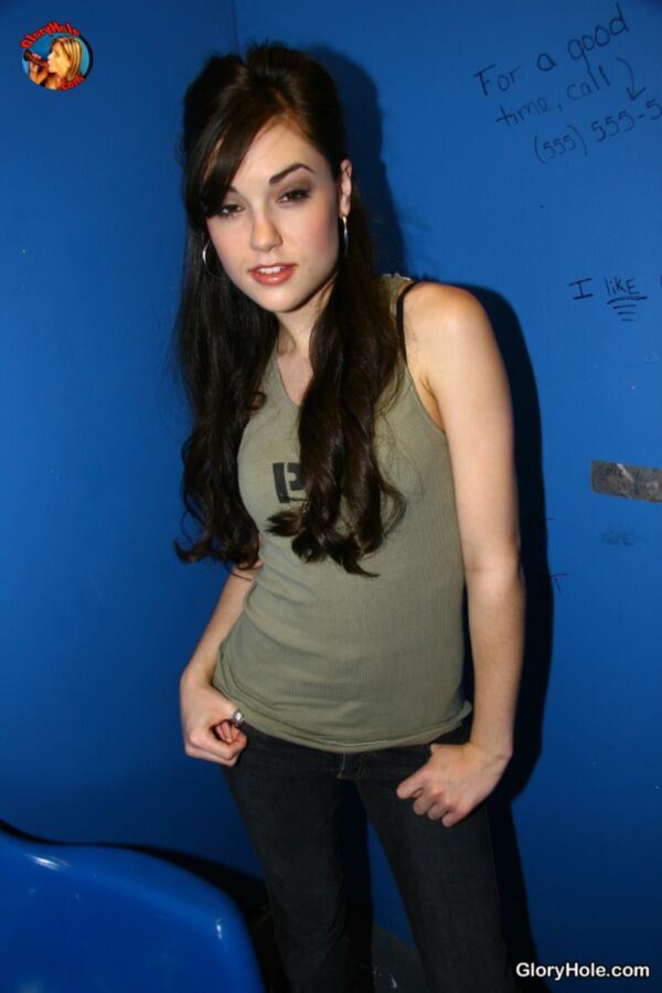 Free porn pics of Sasha Grey going to work in a glory hole 6 of 157 pics