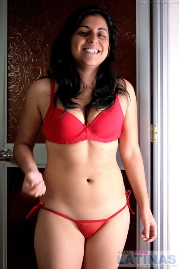 Free porn pics of Latina Stephanie in her red see through lingerie 4 of 15 pics