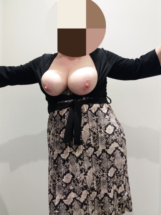Free porn pics of Exposing her tits for you in a fittingroom 2 of 5 pics