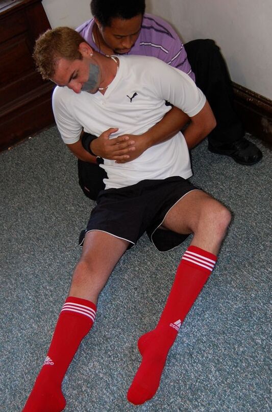 Free porn pics of Soccer player tied up in their red soccer socks 12 of 35 pics