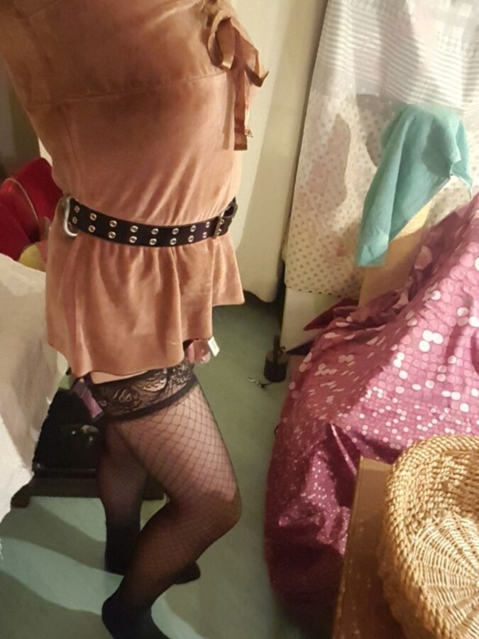 Free porn pics of Fancy sissy in fishnets and chastity 8 of 9 pics