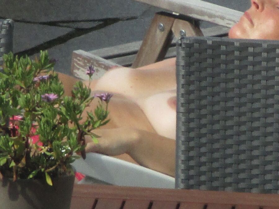 Free porn pics of Neighbor sunbathing naked tits!!! 5 of 14 pics