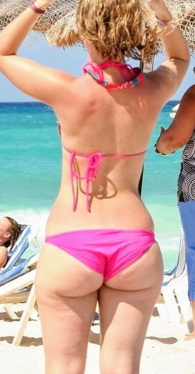 Free porn pics of juicy ass in pink on beach 1 of 7 pics
