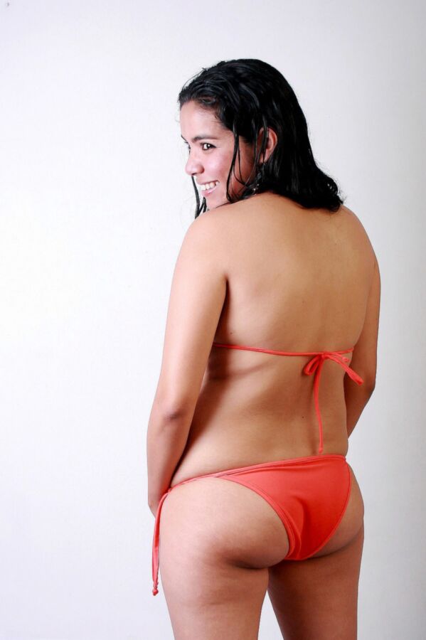 Free porn pics of Chuby latina Lorena in her orange bikini shows hairy pussy 4 of 15 pics