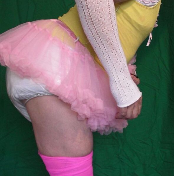 Free porn pics of Peter Went diapered sissy in pretty yellow camisole  2 of 6 pics