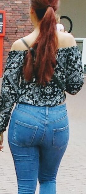Free porn pics of red longhair bitch show his ass in jeans on the street  5 of 5 pics
