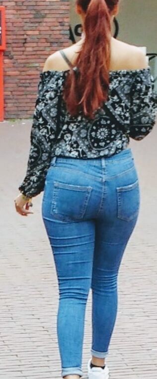Free porn pics of red longhair bitch show his ass in jeans on the street  4 of 5 pics