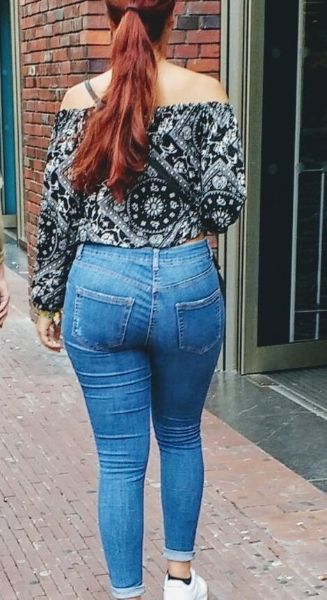 Free porn pics of red longhair bitch show his ass in jeans on the street  1 of 5 pics