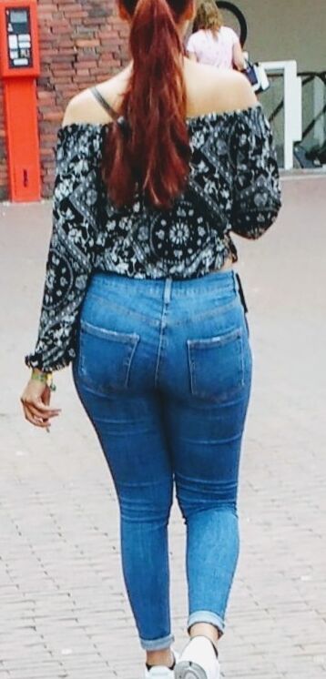 Free porn pics of red longhair bitch show his ass in jeans on the street  2 of 5 pics