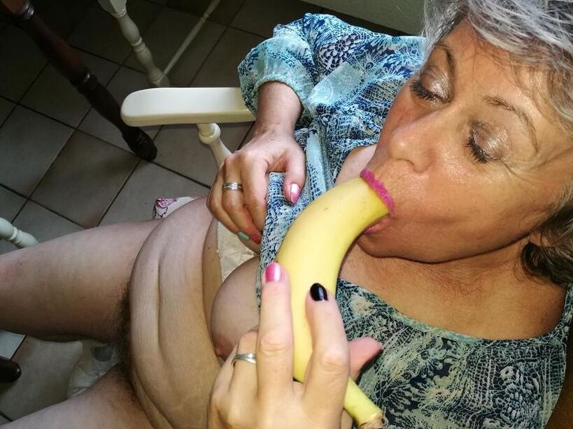 Free porn pics of Horny granny Caro sticks a banana inside her natural pussy  1 of 18 pics