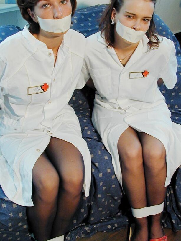 Two cute nurses tied up and gagged 2 of 75 pics