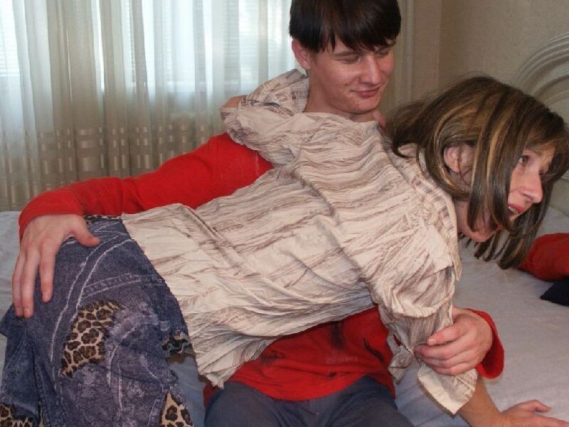 Spanking - Boy in red sweater spanking older woman 3 of 12 pics