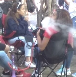 Teen Hookah Smoker Latina Girl at Parade 1 of 18 pics