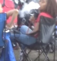 Teen Hookah Smoker Latina Girl at Parade 13 of 18 pics