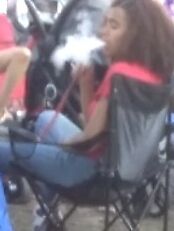 Teen Hookah Smoker Latina Girl at Parade 12 of 18 pics