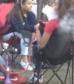 Teen Hookah Smoker Latina Girl at Parade 6 of 18 pics