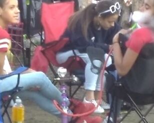 Teen Hookah Smoker Latina Girl at Parade 2 of 18 pics