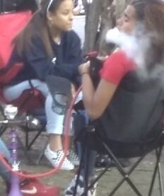Teen Hookah Smoker Latina Girl at Parade 5 of 18 pics