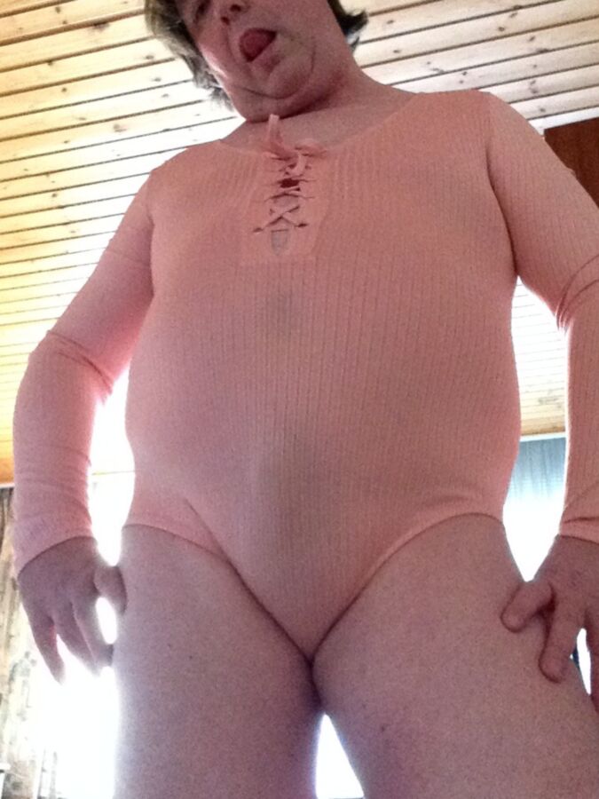 Flashing in a pink bodysuit 9 of 53 pics