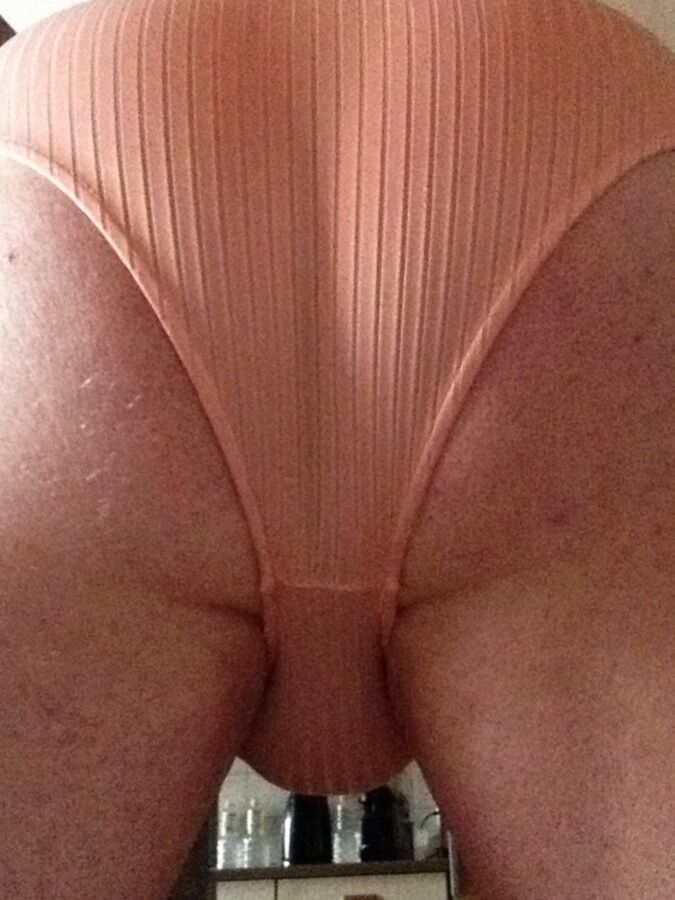 Flashing in a pink bodysuit 14 of 53 pics