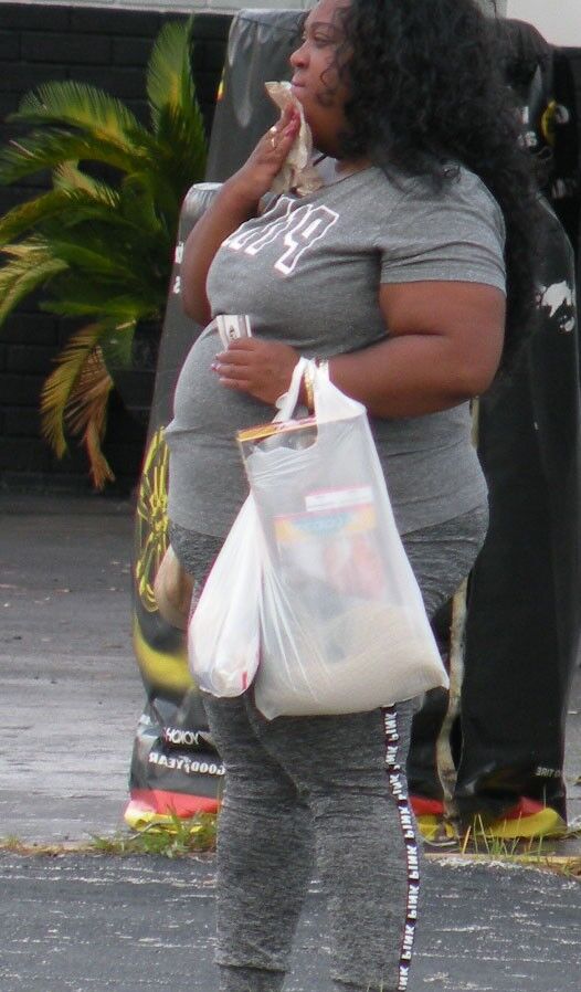 Ebony BBW with a big belly and TIGHT OUTFIT Ball Buster HOT 2 of 14 pics