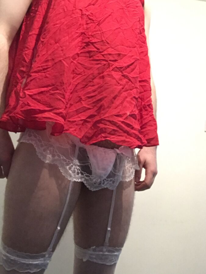 Sissy in Red Nighty, Stockings and a Plug 4 of 6 pics