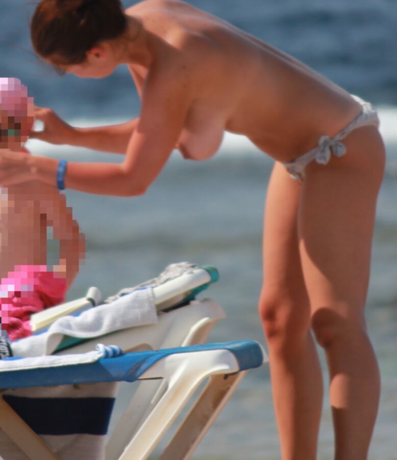 Young mom on the beach (Topless) 10 of 51 pics