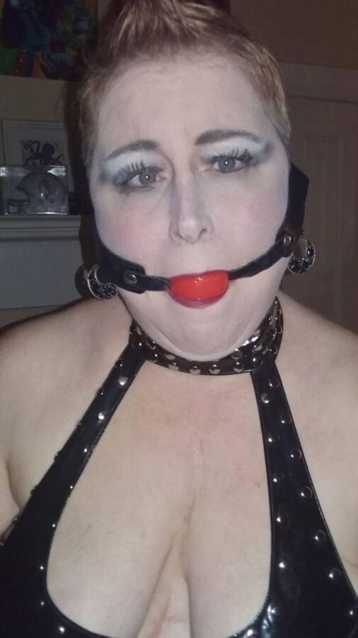 Mowhawked Wife In Vinyl Gets Choked & Ball Gagged 8 of 16 pics
