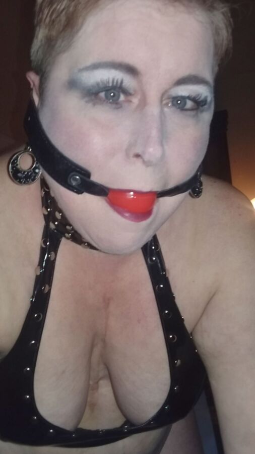 Mowhawked Wife In Vinyl Gets Choked & Ball Gagged 5 of 16 pics