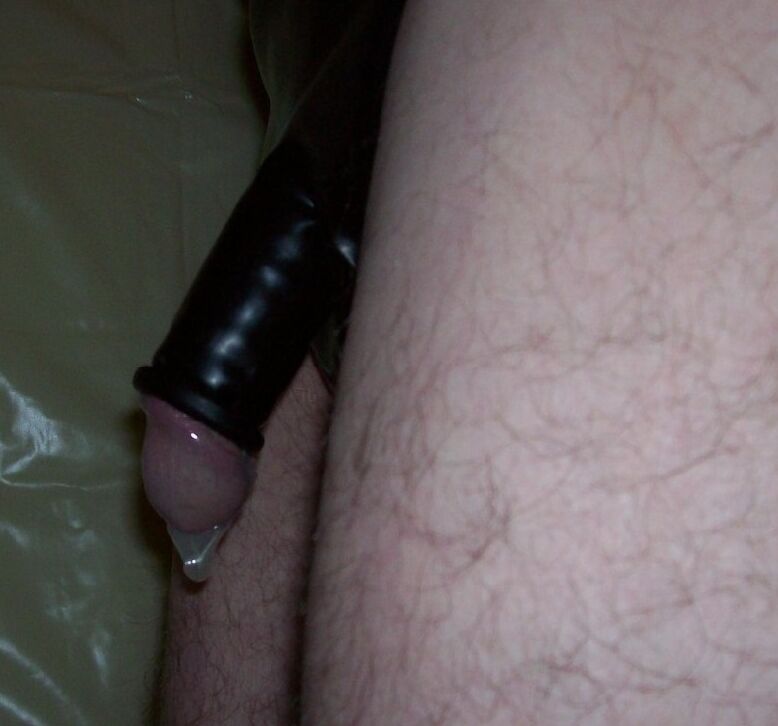 me in black rubber pants and condoms 8 of 11 pics