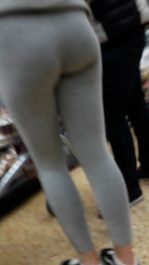 Young Cocktease in tight grey leggings,amazing firm arse 2 of 13 pics