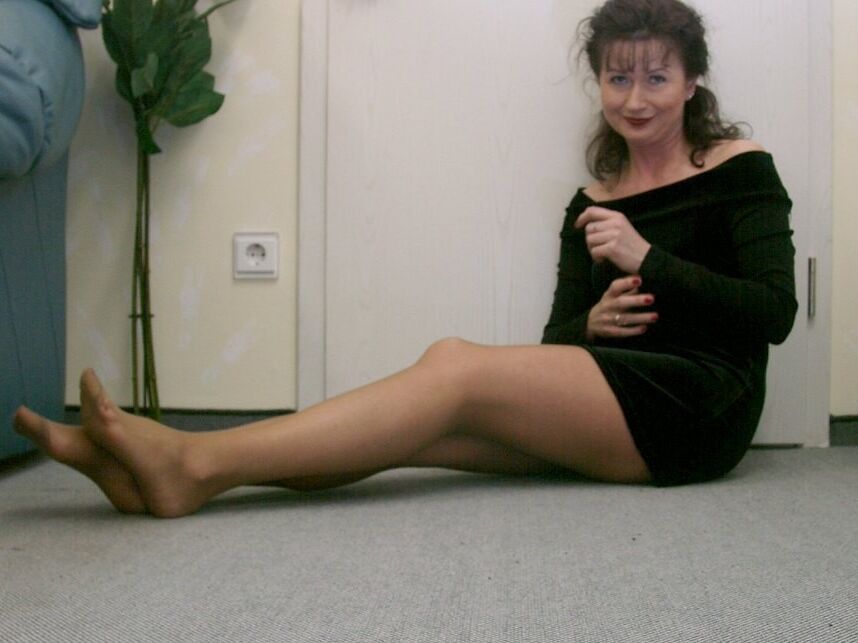 Aunty in pantyhose playing with plush toy 19 of 52 pics