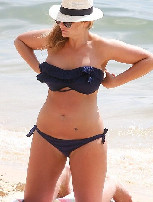 Fiona Falkiner shows off her curves in a tiny two piece at Beach 8 of 15 pics