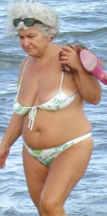 Granny in mini-bikini on the beach 9 of 10 pics