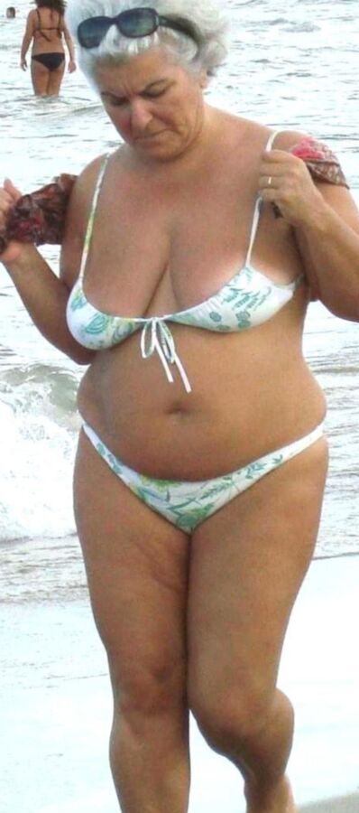 Granny in mini-bikini on the beach 8 of 10 pics